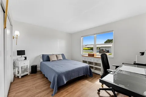 a bathroom with a toilet a sink and a mirror