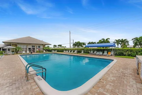 a view of a swimming pool with a lake view