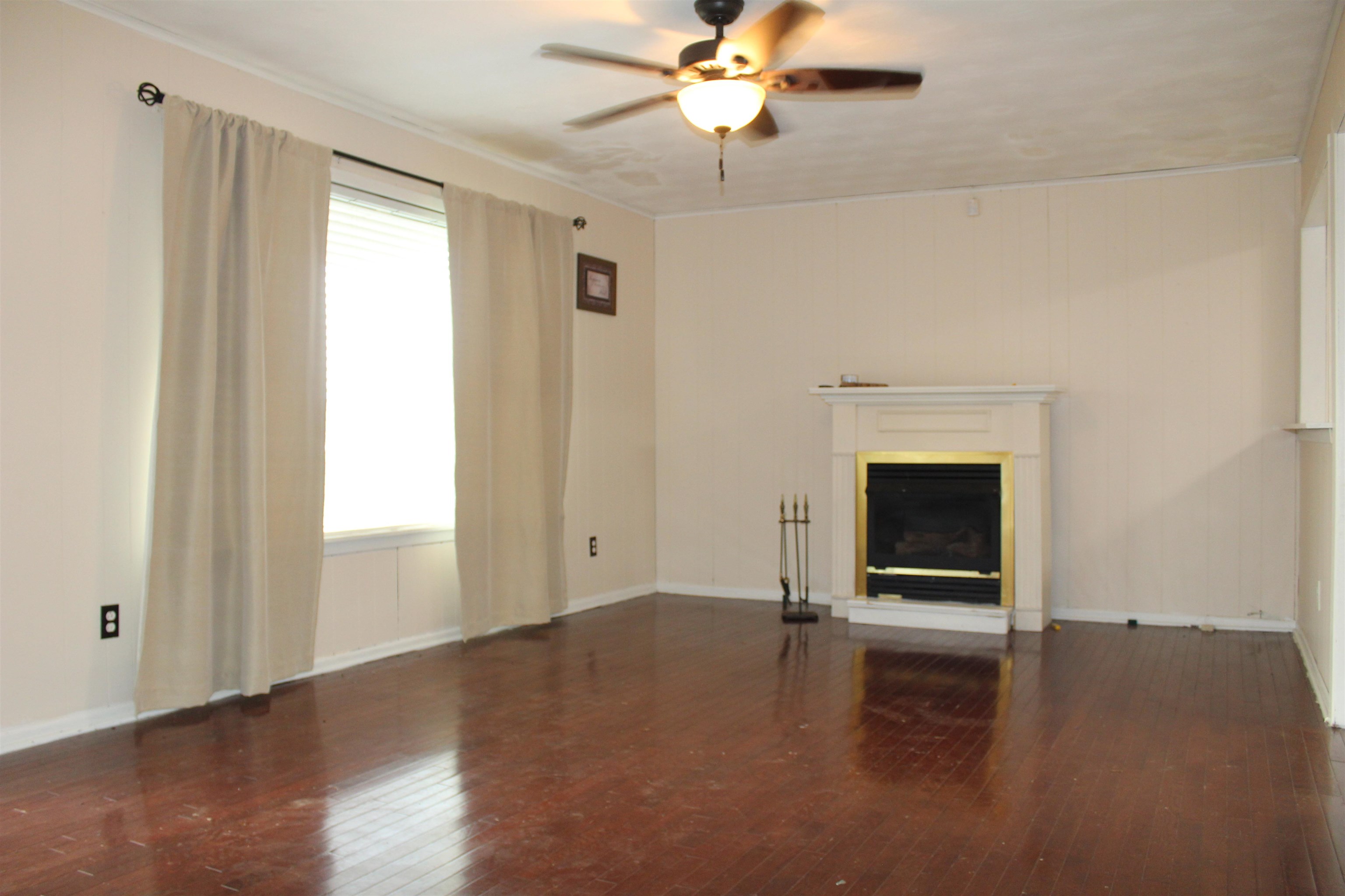 1832 Curve Nankipoo Road Ripley, TN 38063 - Photo 5 of 18 a view of empty room with wooden floor and fan