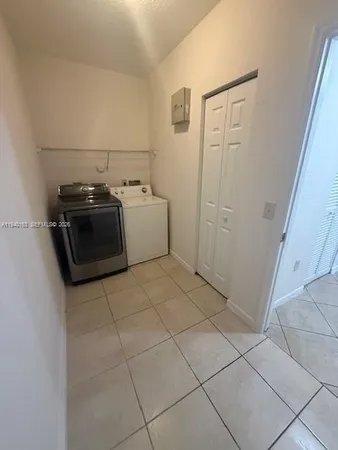 a view of a utility room with a sink