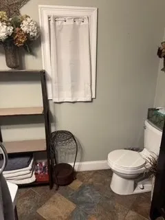 a bathroom with a toilet and a sink