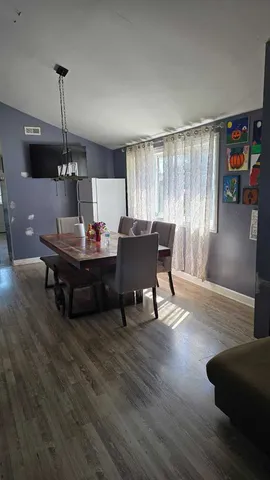 a bedroom with bed and window