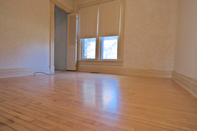 11814 Maple Avenue Hebron, IL 60034 - Photo 13 of 20 a view of an empty room with wooden floor and a window