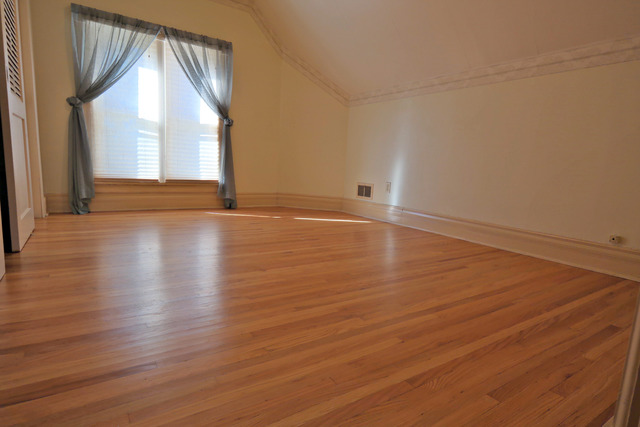 11814 Maple Avenue Hebron, IL 60034 - Photo 14 of 20 an empty room with wooden floor and windows