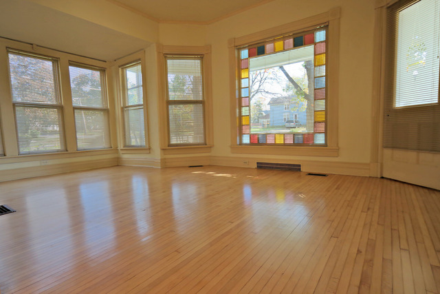 11814 Maple Avenue Hebron, IL 60034 - Photo 6 of 20 a view of empty room with wooden floor and fan