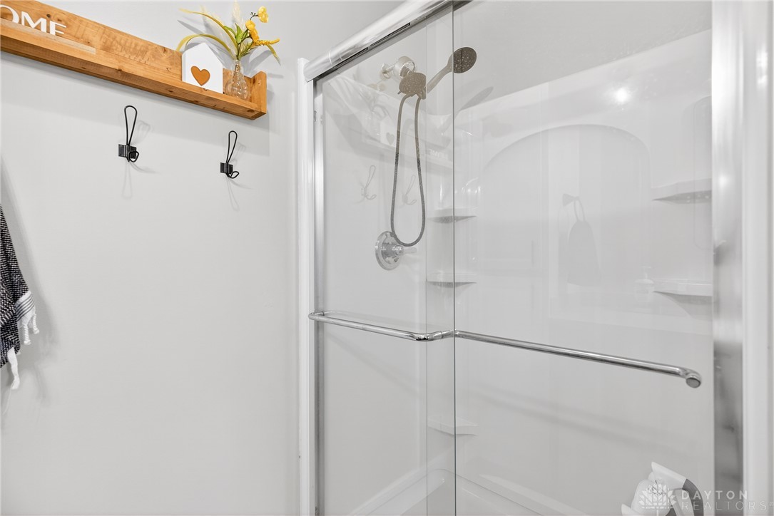 7888 Darke-Preble County Line Road Arcanum, OH 45304 - Photo 34 of 51 This bathroom features a contemporary glass-enclosed shower.