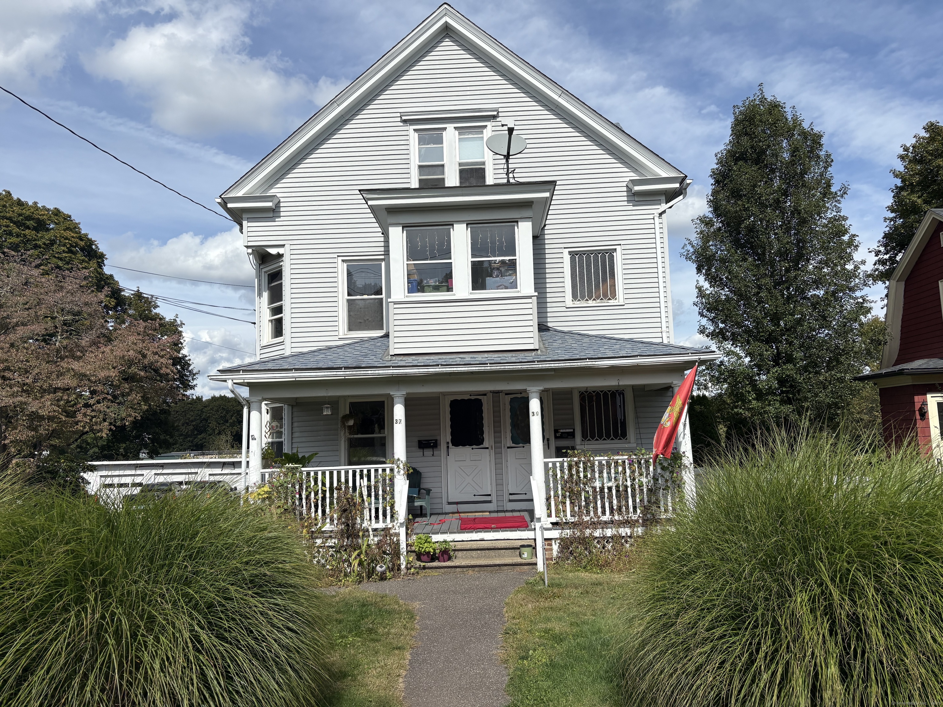 a front view of a house with garden