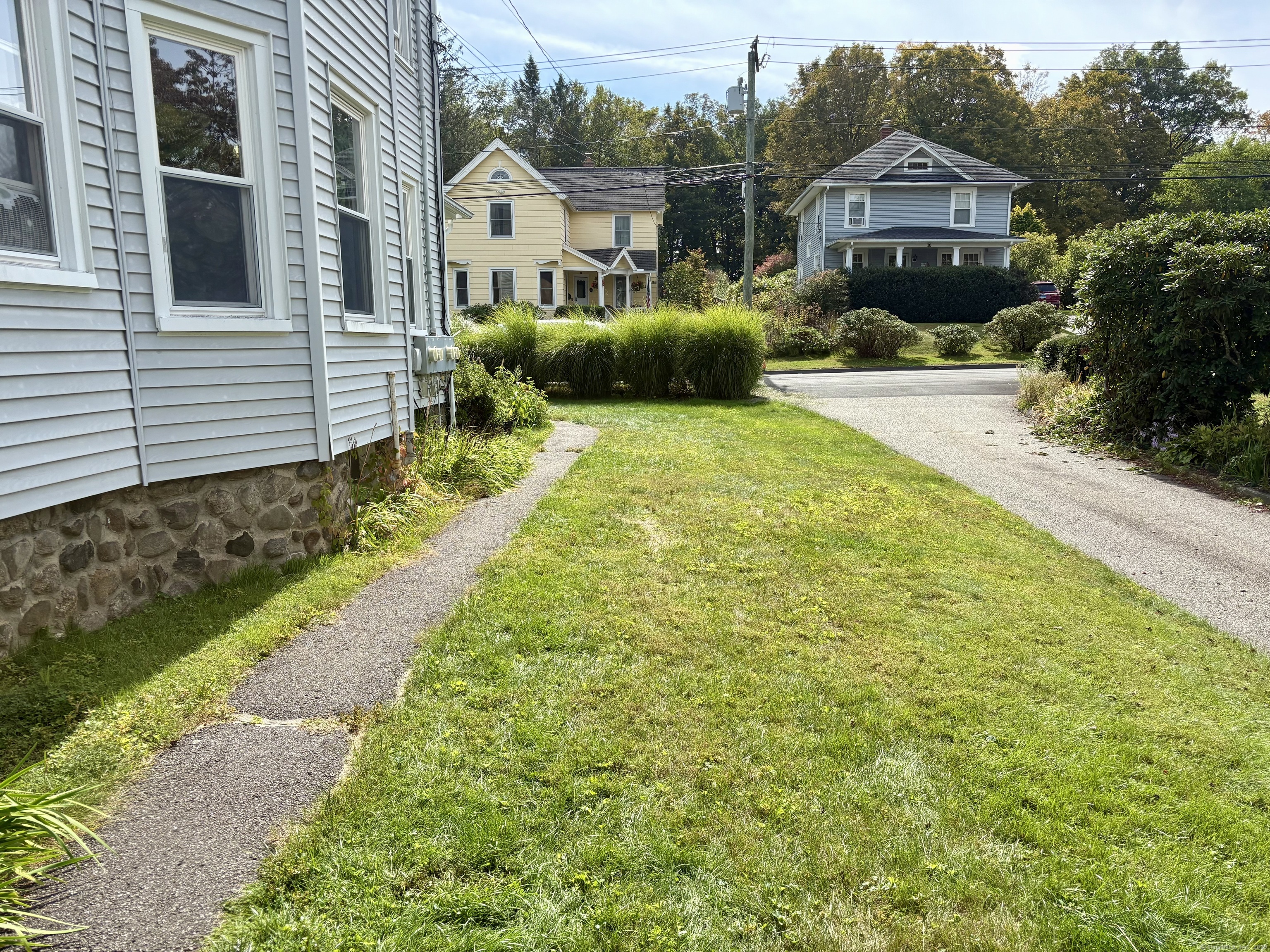 37 Hungerford Avenue, Unit 3 Watertown, CT 06779 - Photo 12 of 15 a front view of a house with a yard