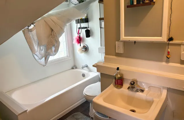 a bathroom with a sink and a bathtub