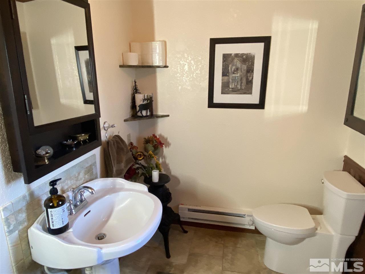 2065 Applegate Road Reno, NV 89521 - Photo 14 of 36 a bathroom with a toilet sink and mirror