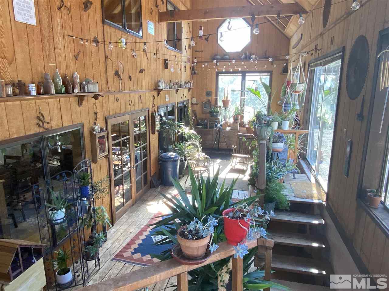 2065 Applegate Road Reno, NV 89521 - Photo 3 of 36 a vase of flowers sitting on a table in front of a building