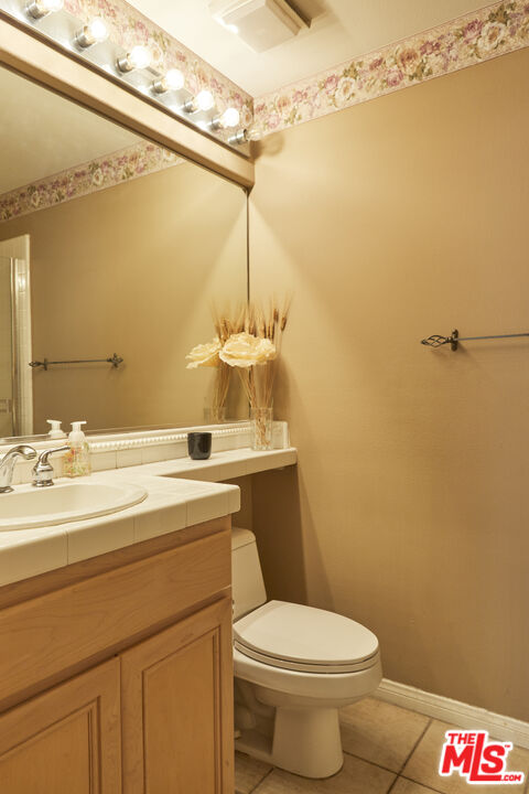 6 Mountainbrook Irvine, CA 92620 - Photo 12 of 31 a bathroom with a sink a toilet and shower