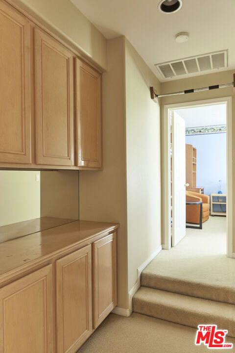 6 Mountainbrook Irvine, CA 92620 - Photo 19 of 31 a spacious bedroom with a bed and cabinets