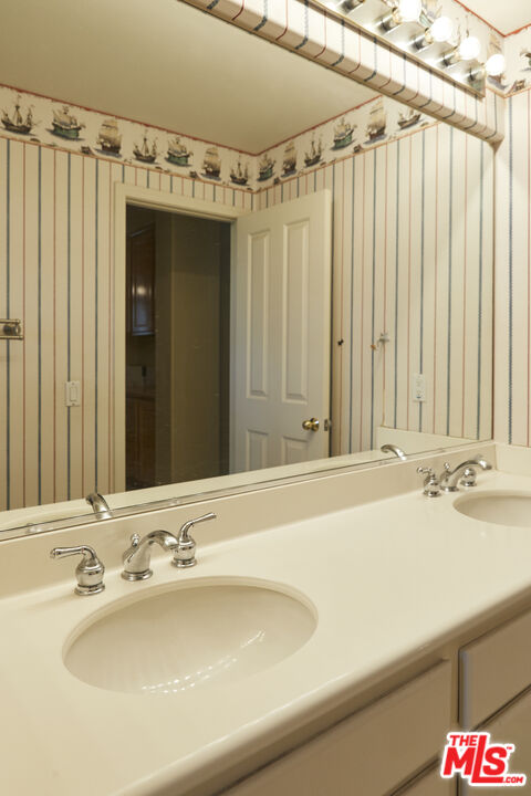 6 Mountainbrook Irvine, CA 92620 - Photo 20 of 31 a bathroom with a sink and a mirror