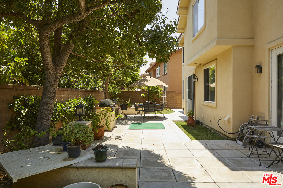 6 Mountainbrook Irvine, CA 92620 - Photo 24 of 31 a view of a patio with couches table and chairs with potted plants