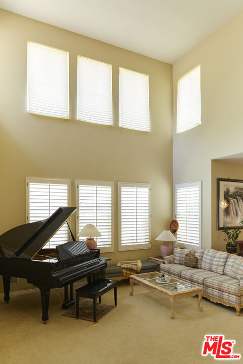 6 Mountainbrook Irvine, CA 92620 - Photo 4 of 31 a living room with furniture pool table and a window