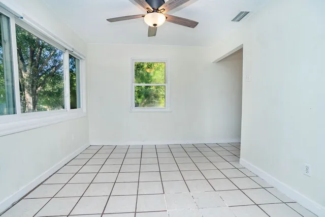 a view of an empty room and window