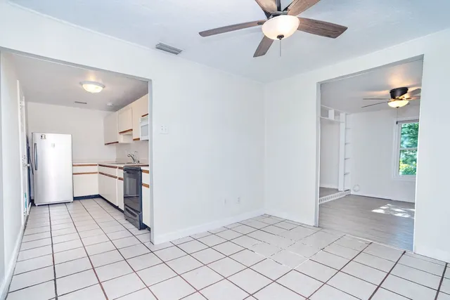 a view of a kitchen with a sink and a stove top oven