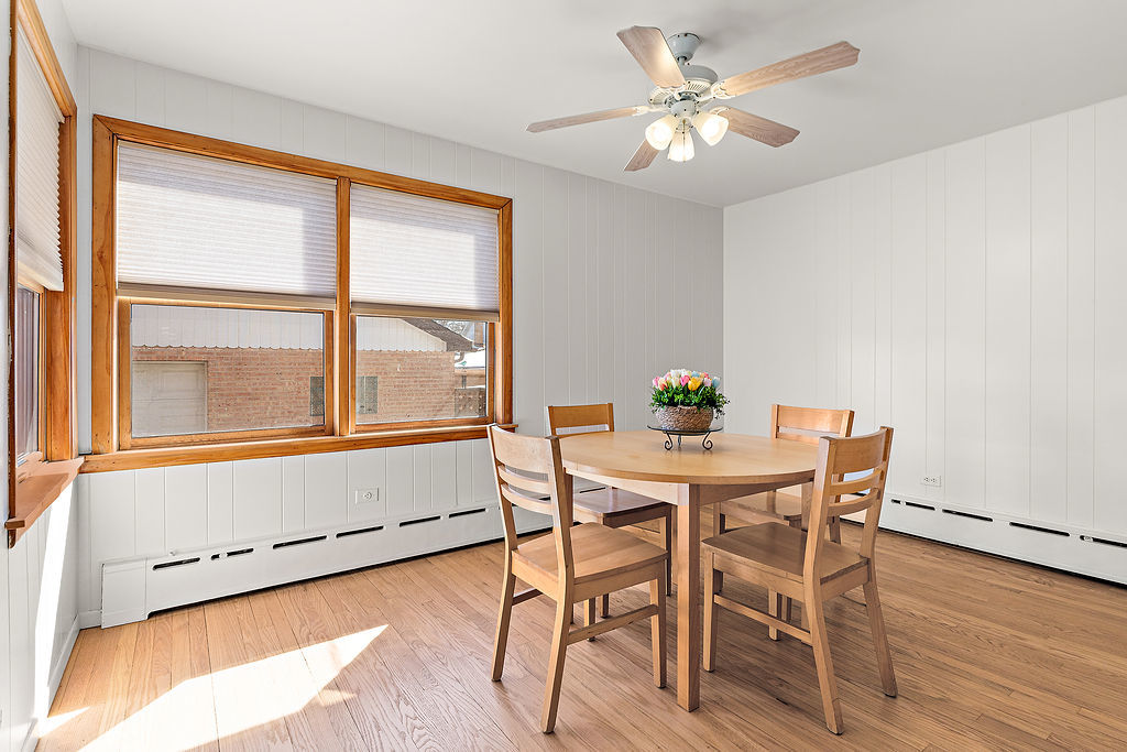 5353 North Nottingham Avenue Chicago, IL 60656 - Photo 6 of 20 a view of a dining room with furniture window and wooden floor
