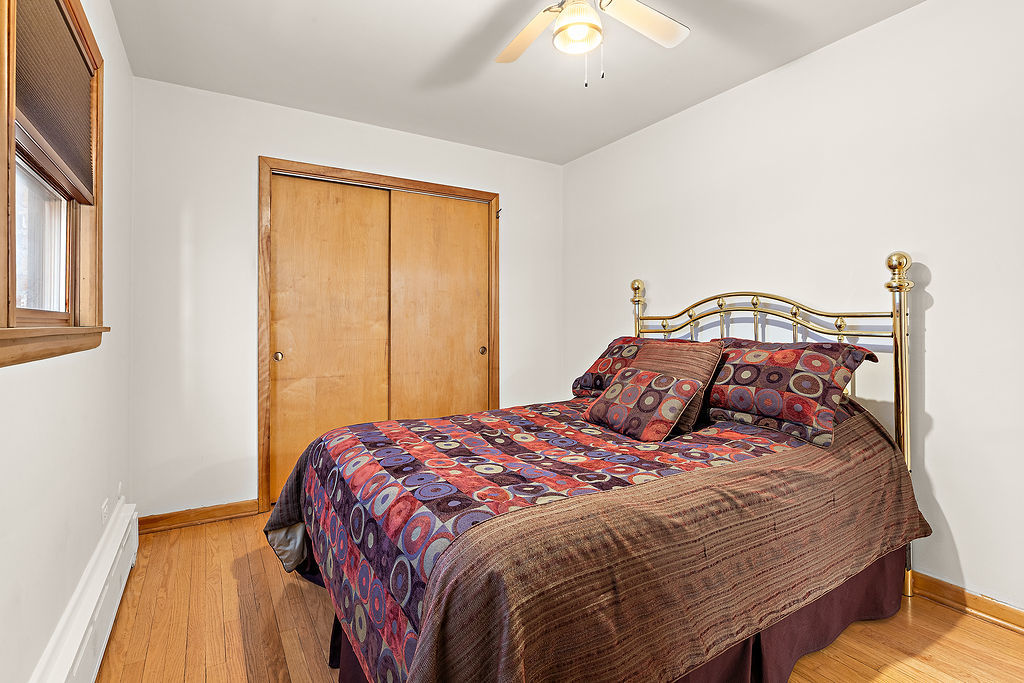 5353 North Nottingham Avenue Chicago, IL 60656 - Photo 9 of 20 a bedroom with a bed and a window
