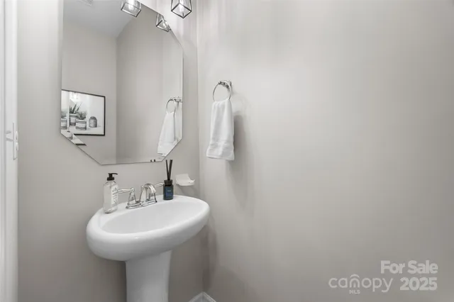 a bathroom with a sink and mirror