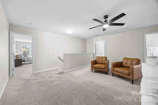 a bedroom with furniture and window