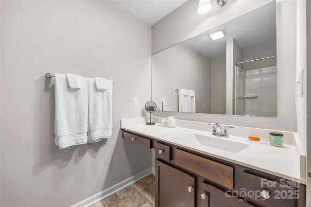 a bathroom with a sink double vanity and a mirror
