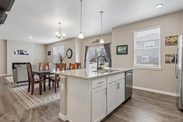a view of dining table chairs and window