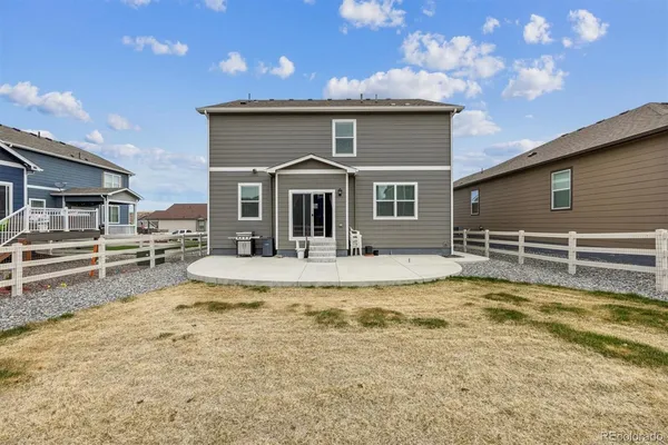 a view of a house with swimming pool in front of it