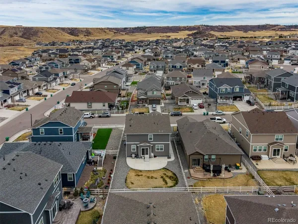 an aerial view of residential houses with outdoor space