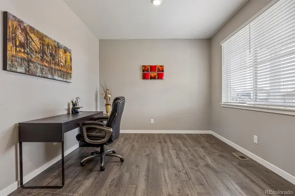a workspace with a desk and chair