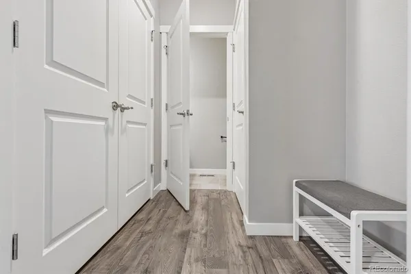 a view of room with wooden floor