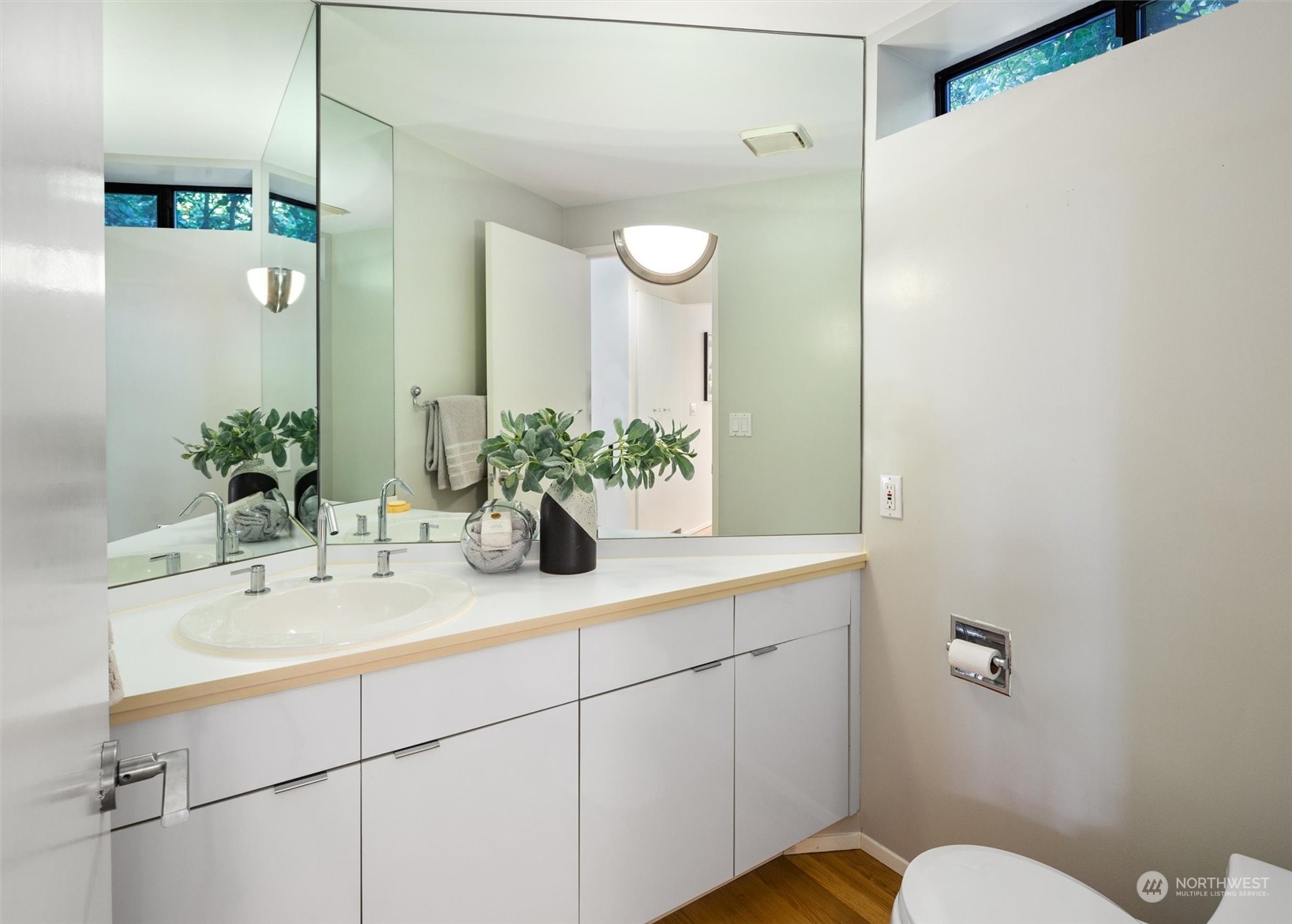 3 Lindley Road Mercer Island, WA 98040 - Photo 14 of 37 a bathroom with a sink and a mirror
