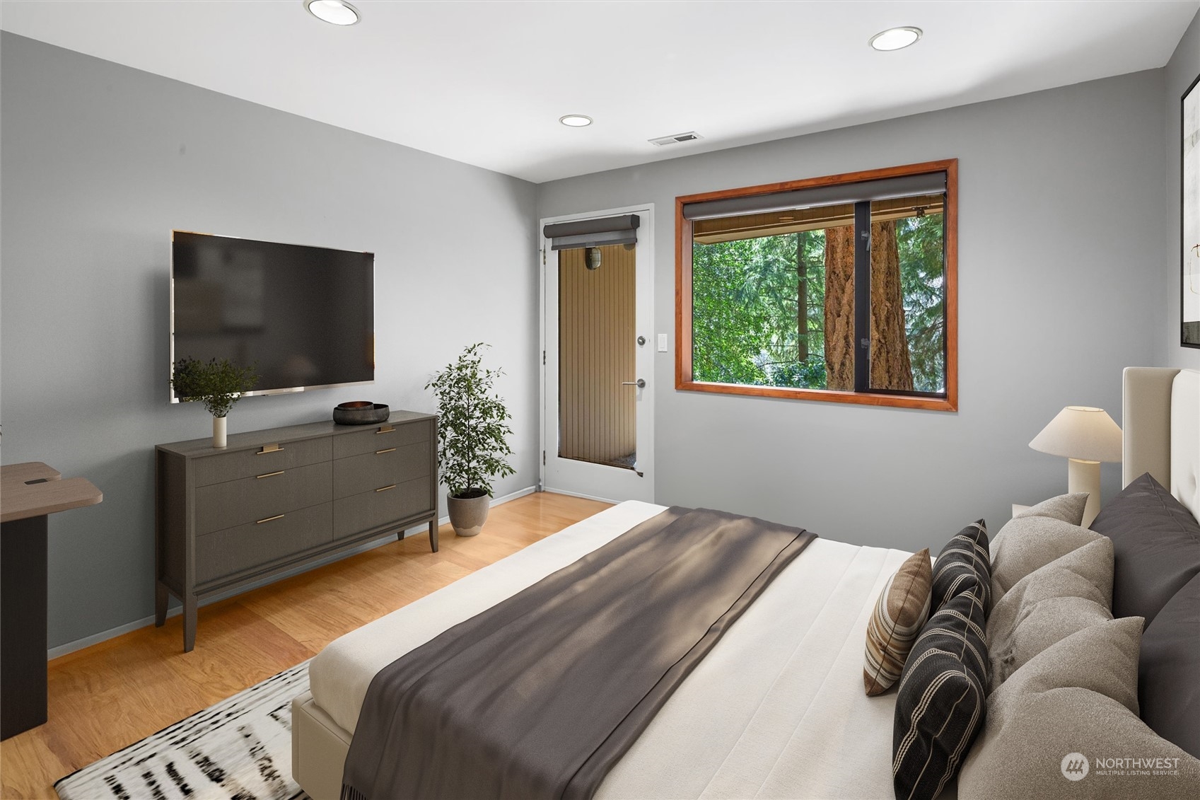 3 Lindley Road Mercer Island, WA 98040 - Photo 26 of 37 a bedroom with a bed and a flat screen tv