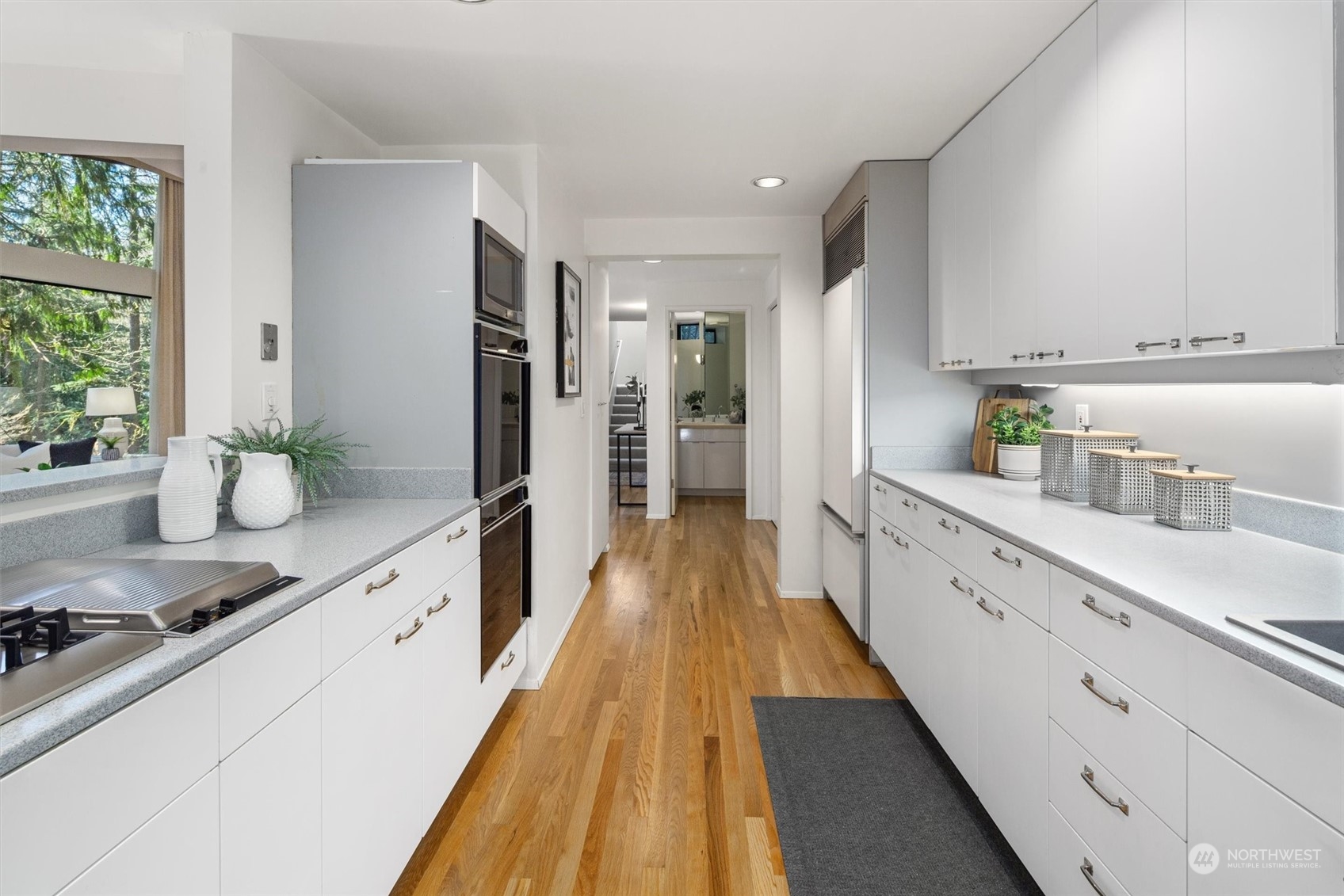 3 Lindley Road Mercer Island, WA 98040 - Photo 7 of 37 a large white kitchen with cabinets a sink and a refrigerator