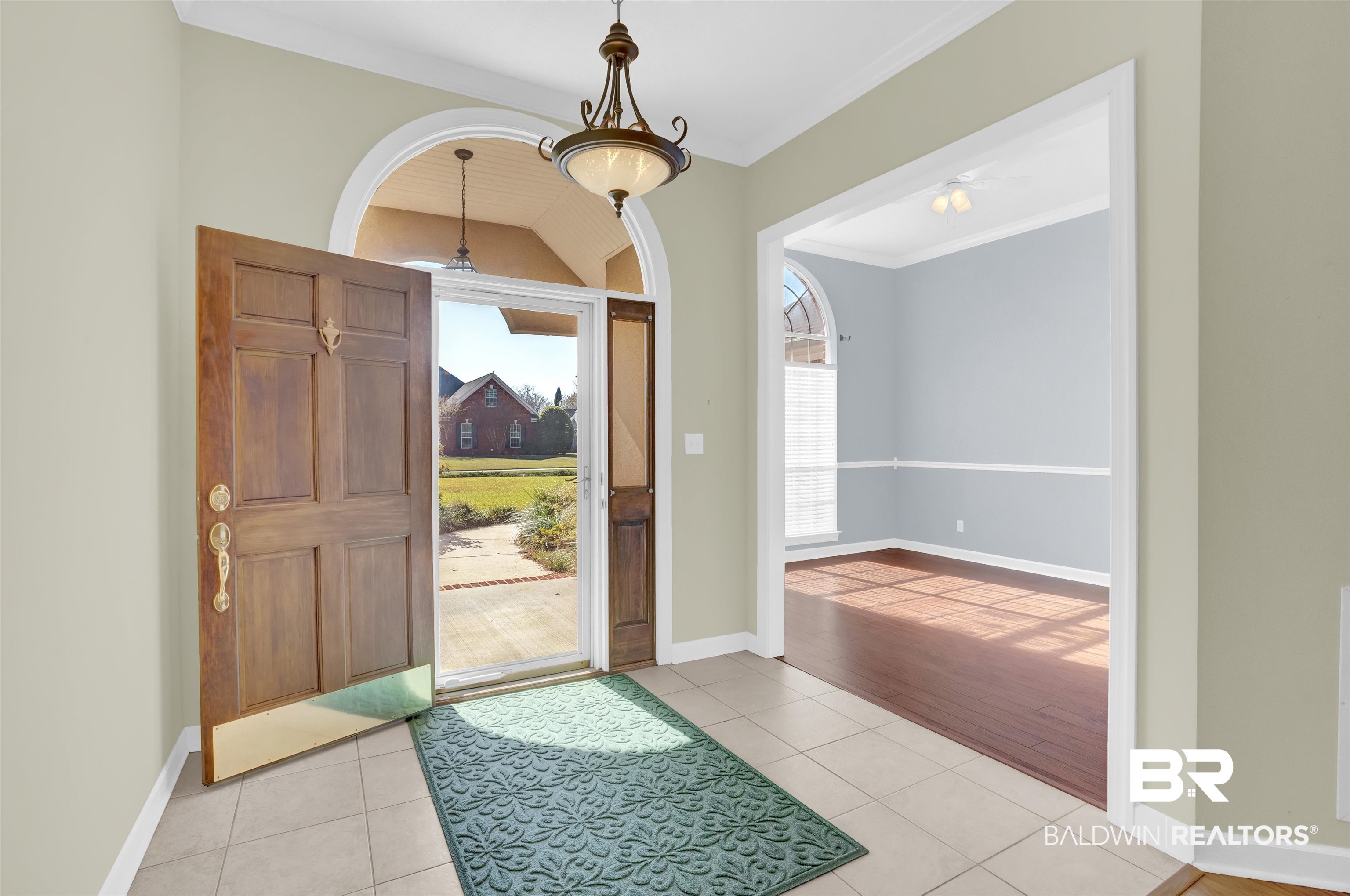 100 Conti Court Fairhope, AL 36532 - Photo 15 of 54 Tiled foyer entrance featuring lofted ceiling, ceiling fan, and ornamental molding