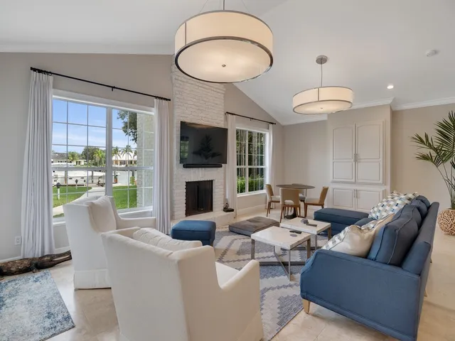 a large kitchen with granite countertop a sink and a refrigerator