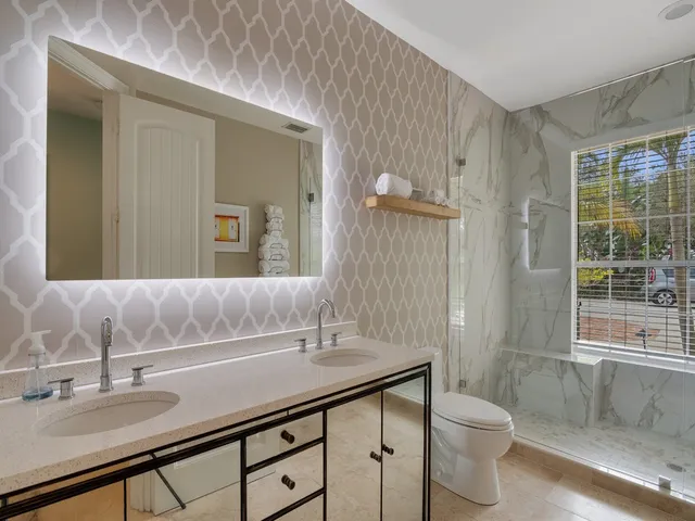 a bedroom with a bed couch and window