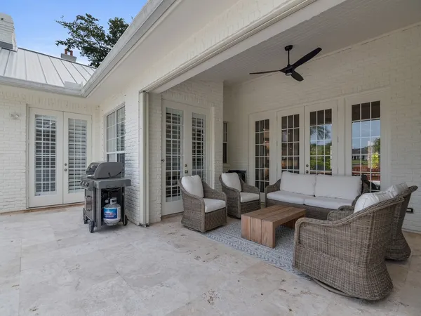 a view of a backyard with swimming pool