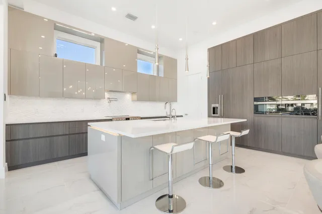a kitchen with a sink a counter space and appliances