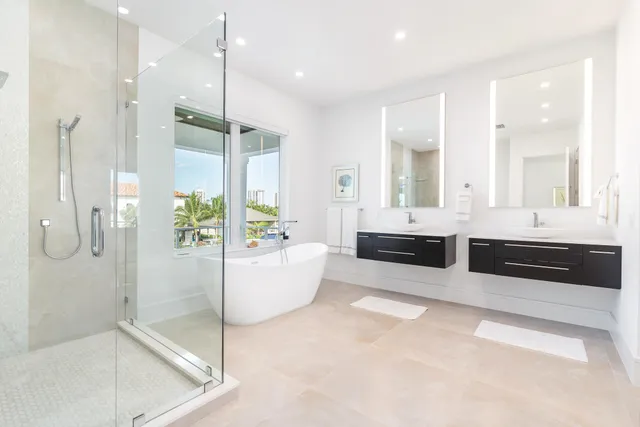 a large bathroom with a large tub and shower