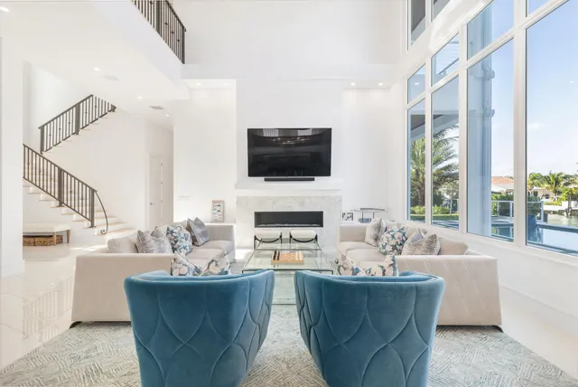 a living room with fireplace furniture and a flat screen tv