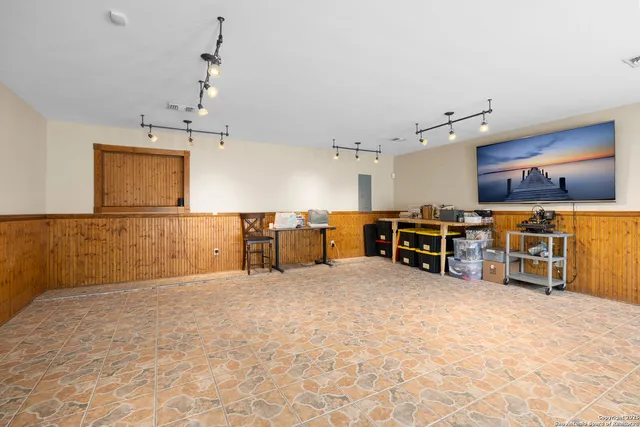 a view of a kitchen with furniture and a chandelier