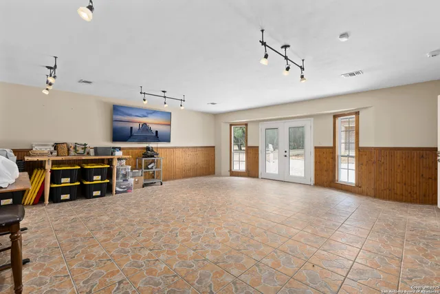 a view of a kitchen with furniture and windows