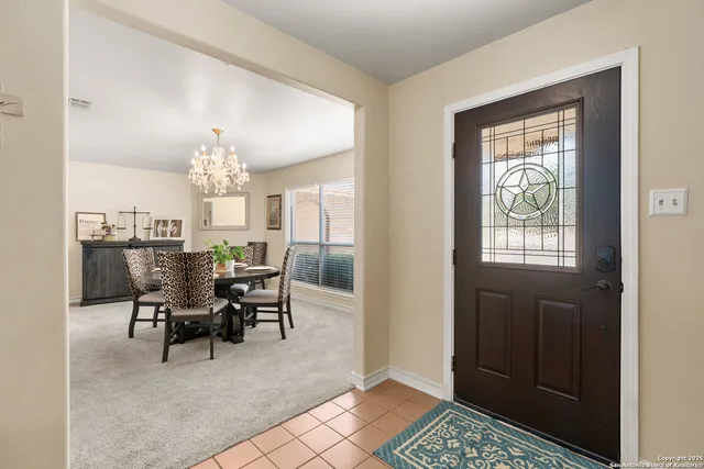 a view of a livingroom with kitchen and dining area