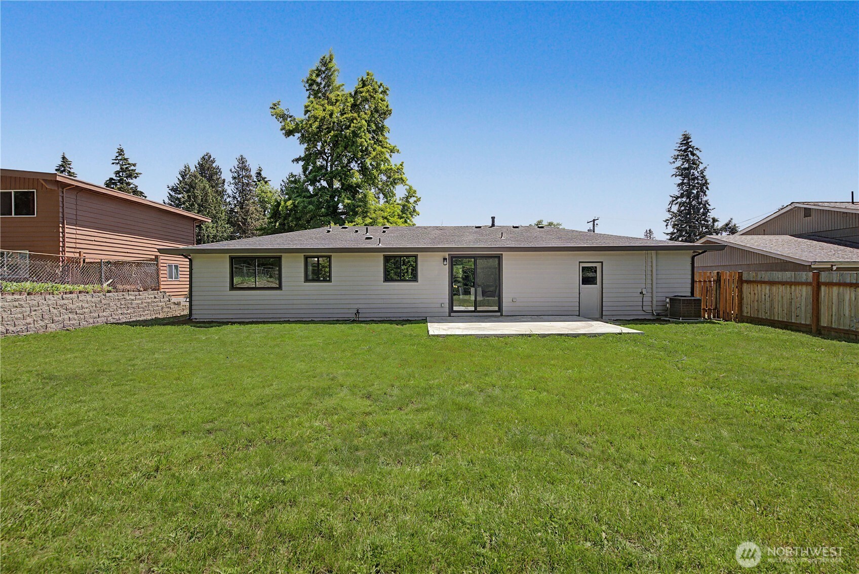 10646 Southeast 236th Street Kent, WA 98031 - Photo 17 of 20 a view of a house with a backyard