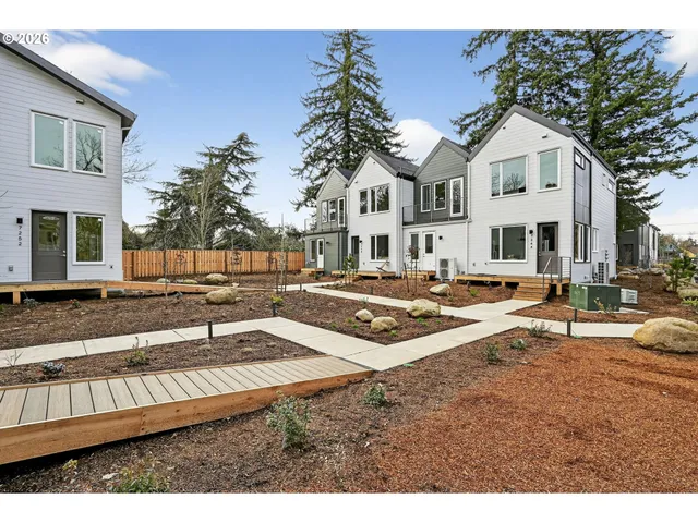 a swimming pool with trees in the background