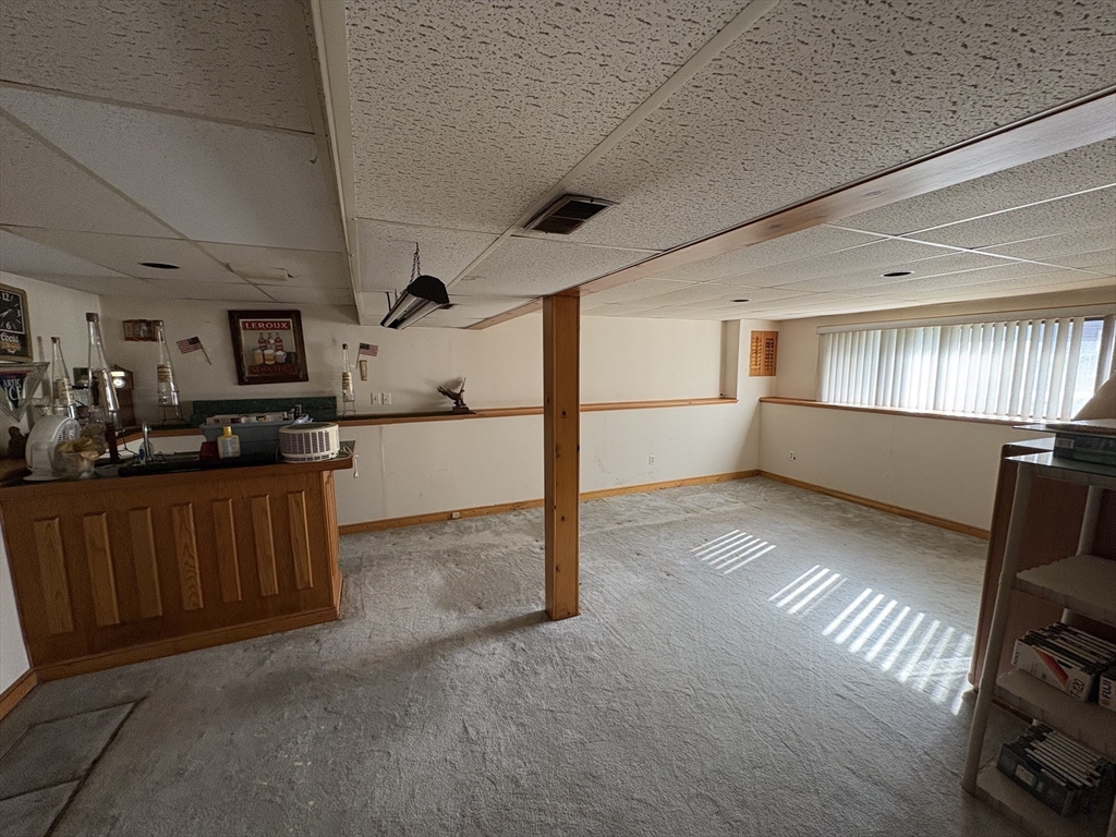 172 Russ Street Randolph, MA 02368 - Photo 13 of 15 a view of a kitchen with furniture and a window