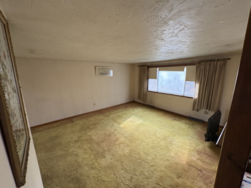 172 Russ Street Randolph, MA 02368 - Photo 6 of 15 an empty room with windows