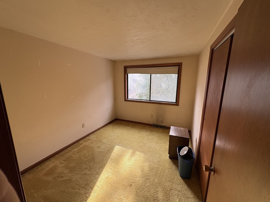 172 Russ Street Randolph, MA 02368 - Photo 10 of 15 an empty room with windows